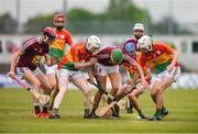 19 May 2019; Westmeath players Brian Farrell, left, and Andrew Shaw, centre, battles for possession against Carlow players, from left, Eric English, Ger Kavanagh, and Lorcan Doyle during the Electric Ireland Leinster Minor Hurling Championship between Carlow and Westmeath at Netwatch Cullen Park in Carlow.  Photo by Ben McShane/Sportsfile