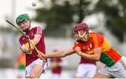 19 May 2019; Shane Williams of Westmeath scores a point despite the attention of Jack McCullough of Carlow during the Electric Ireland Leinster Minor Hurling Championship between Carlow and Westmeath at Netwatch Cullen Park in Carlow.  Photo by Ben McShane/Sportsfile
