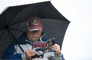 19 May 2019; A Galway fan reads the match programme prior to the Connacht GAA Football Senior Championship semi-final match between Sligo and Galway at Markievicz Park in Sligo. Photo by Harry Murphy/Sportsfile