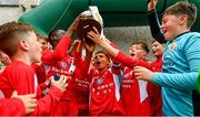 19 May 2019; Cork captain Matthew Moore lifts the cup following the Under 12 SFAI Subway Championship Final match between Donegal and Cork at Mullingar Athletic in Gainstown, Westmeath. Photo by Ramsey Cardy/Sportsfile
