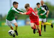 19 May 2019; Cathal O'Sullivan of Cork in action against Turlough Carr of Donegal during the Under 12 SFAI Subway Championship Final match between Donegal and Cork at Mullingar Athletic in Gainstown, Westmeath. Photo by Ramsey Cardy/Sportsfile