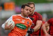 19 May 2019; Jamie Clarke of Armagh in action against Gerard Collins of Down during the GAA Football Senior Championship quarter-final match between Down and Armagh at Páirc Esler in Newry. Photo by Philip Fitzpatrick/Sportsfile