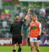 19 May 2019; Referee Anthony Nolan from Wicklow hands out a yellow card to Rian OÕNeill  of Armagh during the GAA Football Senior Championship quarter-final match between Down and Armagh at Páirc Esler in Newry. Photo by Philip Fitzpatrick/Sportsfile
