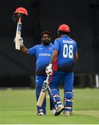 21 May 2019; Mohammad Shahzad of Afghanistan celebrates his 100 not out with Rahmat Shah during the GS Holdings ODI Challenge between Ireland and Afghanistan at Stormont in Belfast. Photo by Oliver McVeigh/Sportsfile