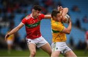 25 May 2019; Conor Beirne of Leitrim in action against Barry Duffy of Mayo during the Connacht GAA Football Junior Championship Semi-Final match between Mayo and Leitrim at Elverys MacHale Park in Castlebar, Mayo. Photo by Stephen McCarthy/Sportsfile
