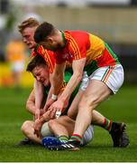 25 May 2019; Thomas O'Reilly of Meath in action against Ciarán Moran, left, and Conor Doyle of Carlow during the Leinster GAA Football Senior Championship Quarter-Final match between Carlow and Meath at O’Moore Park in Portlaoise, Laois. Photo by Ray McManus/Sportsfile