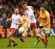 25 May 2019; Ben McDonnell of Tyrone in action against Niall Delargy of Antrim during the Ulster GAA Football Senior Championship Quarter-Final match between Antrim and Tyrone at the Athletic Grounds in Armagh. Photo by Oliver McVeigh/Sportsfile