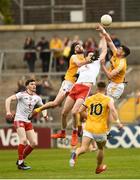 25 May 2019; Colm Cavanagh of Tyrone in action against Matthew Fitzpatrick and Colum Duffin of Antrim during the Ulster GAA Football Senior Championship Quarter-Final match between Antrim and Tyrone at the Athletic Grounds in Armagh. Photo by Oliver McVeigh/Sportsfile