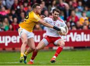 25 May 2019; Ronan McNamee of Tyrone in action against Kevin Quinn of Antrim during the Ulster GAA Football Senior Championship Quarter-Final match between Antrim and Tyrone at the Athletic Grounds in Armagh. Photo by Oliver McVeigh/Sportsfile