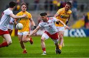 25 May 2019; Matthew Donnelly of Tyrone in action against Patrick Gallagher of Antrim during the Ulster GAA Football Senior Championship Quarter-Final match between Antrim and Tyrone at the Athletic Grounds in Armagh. Photo by Oliver McVeigh/Sportsfile