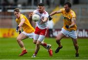 25 May 2019; Matthew Donnelly of Tyrone in action against Odhran Eastwood and Patrick Gallagher of Antrim during the Ulster GAA Football Senior Championship Quarter-Final match between Antrim and Tyrone at the Athletic Grounds in Armagh. Photo by Oliver McVeigh/Sportsfile