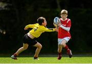 26 May 2019; Dylan Quirke from Co. Limerick in action against Hugh Og Arnold from Rosses Point, Co. Sligo, competing in the Boys Mini Rugby Semi-Final event during Day 2 of the Aldi Community Games May Festival, which saw over 3,500 children take part in a fun-filled weekend at University of Limerick. Photo by Harry Murphy/Sportsfile