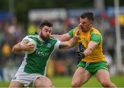 26 May 2019; Kane Connor of Fermanagh in action against Paddy McGrath of Donegal during the Ulster GAA Football Senior Championship Quarter-Final match between Fermanagh and Donegal at Brewster Park in Enniskillen, Fermanagh. Photo by Philip Fitzpatrick/Sportsfile