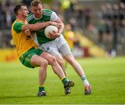 26 May 2019; Leo McLoone of Donegal in action against Aidan Breen of Fermanagh during the Ulster GAA Football Senior Championship Quarter-Final match between Fermanagh and Donegal at Brewster Park in Enniskillen, Fermanagh. Photo by Philip Fitzpatrick/Sportsfile