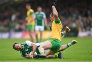 26 May 2019; Paul McCusker of Fermanagh in action against Neil McGee of Donegal during the Ulster GAA Football Senior Championship Quarter-Final match between Fermanagh and Donegal at Brewster Park in Enniskillen, Fermanagh. Photo by Philip Fitzpatrick/Sportsfile