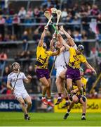 26 May 2019; Lee Chin, left, and Liam Og McGovern of Wexford in action against Aidan Harte, left, and Joseph Cooney of Galway during the Leinster GAA Hurling Senior Championship Round 3A match between Galway and Wexford at Pearse Stadium in Galway. Photo by Stephen McCarthy/Sportsfile