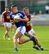 26 May 2019; Denis Booth of Laois in action against Ger Egan of Westmeath during the GAA Football Senior Championship Quarter-Final match between Westmeath and Laois at Bord na Mona O’Connor Park in Tullamore, Offaly. Photo by Ray McManus/Sportsfile