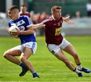 26 May 2019; Denis Booth of Laois in action against Ger Egan of Westmeath during the GAA Football Senior Championship Quarter-Final match between Westmeath and Laois at Bord na Mona O’Connor Park in Tullamore, Offaly. Photo by Ray McManus/Sportsfile