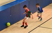 26 May 2019; Shane O'Connor of Inniskeen, Co Monaghan, left, in action against Cormac Flynn of Clonguish, Co Longford, in the Indoor Soccer U13 Boys Semi-Final during Day 2 of the Aldi Community Games May Festival, which saw over 3,500 children take part in a fun-filled weekend at University of Limerick. Photo by Piaras Ó Mídheach/Sportsfile