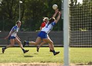 26 May 2019; Orla Finn of Cork scores a point for her side despite the efforts of Caoimhe McGrath of Waterford during the TG4 Munster Ladies Senior Football Championship Round 2 match between Cork and Waterford at Cork Institute of Technology in Cork. Photo by Eóin Noonan/Sportsfile