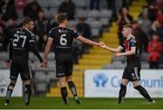27 May 2019; Ross Tierney, right, of Bohemians celebrates after scoring his side's first goal with team-mates Scott Allardice, centre, and Luke Wade-Slater during the EA Sports Cup Quarter-Final match between Bohemians and Cork City at Dalymount Park in Dublin. Photo by Harry Murphy/Sportsfile