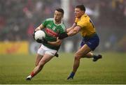 25 May 2019; Evan Regan of Mayo in action against Conor Cox of Roscommon during the Connacht GAA Football Senior Championship Semi-Final match between Mayo and Roscommon at Elverys MacHale Park in Castlebar, Mayo. Photo by Stephen McCarthy/Sportsfile