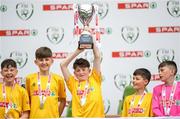 29 May 2019; The SPAR FAI Primary School 5s National Finals took place in AVIVA Stadium on Wednesday, May 29, where former Republic of Ireland International Keith Andrews and current Republic of Ireland women's footballer, Megan Campbell were in attendance supporting as girls and boys from 13 counties battled it out for national honours. The 2019 SPAR FAI Primary School 5s Programme was the biggest yet with a record 37,448 participants from 1,696 schools taking part in county, regional and provincial blitzes nationwide. Pictured St. Oran's NS players from Cockhill, Co. Donegal, lift the trophy at the Aviva Stadium in Dublin. Photo by Harry Murphy/Sportsfile