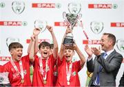 29 May 2019; The SPAR FAI Primary School 5s National Finals took place in AVIVA Stadium on Wednesday, May 29, where former Republic of Ireland International Keith Andrews and current Republic of Ireland women's footballer, Megan Campbell were in attendance supporting as girls and boys from 13 counties battled it out for national honours. The 2019 SPAR FAI Primary School 5s Programme was the biggest yet with a record 37,448 participants from 1,696 schools taking part in county, regional and provincial blitzes nationwide. Pictured Trafask NS players from Beara, Co. Cork, lift the trophy at the Aviva Stadium in Dublin. Photo by Harry Murphy/Sportsfile