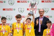 29 May 2019; The SPAR FAI Primary School 5s National Finals took place in AVIVA Stadium on Wednesday, May 29, where former Republic of Ireland International Keith Andrews and current Republic of Ireland women's footballer, Megan Campbell were in attendance supporting as girls and boys from 13 counties battled it out for national honours. The 2019 SPAR FAI Primary School 5s Programme was the biggest yet with a record 37,448 participants from 1,696 schools taking part in county, regional and provincial blitzes nationwide. Pictured is St. Oran's NS players from Cockhill, Co. Donegal, lift the trophy at the Aviva Stadium in Dublin. Photo by Harry Murphy/Sportsfile