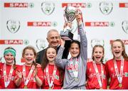 29 May 2019; The SPAR FAI Primary School 5s National Finals took place in AVIVA Stadium on Wednesday, May 29, where former Republic of Ireland International Keith Andrews and current Republic of Ireland women's footballer, Megan Campbell were in attendance supporting as girls and boys from 13 counties battled it out for national honours. The 2019 SPAR FAI Primary School 5s Programme was the biggest yet with a record 37,448 participants from 1,696 schools taking part in county, regional and provincial blitzes nationwide. Pictured Crusheen NS players from Clare lift the trophy at the Aviva Stadium in Dublin.   Photo by Harry Murphy/Sportsfile