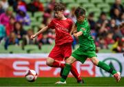 29 May 2019; The SPAR FAI Primary School 5s National Finals took place in AVIVA Stadium on Wednesday, May 29, where former Republic of Ireland International Keith Andrews and current Republic of Ireland women's footballer, Megan Campbell were in attendance supporting as girls and boys from 13 counties battled it out for national honours. The 2019 SPAR FAI Primary School 5s Programme was the biggest yet with a record 37,448 participants from 1,696 schools taking part in county, regional and provincial blitzes nationwide. Pictured is Ronan O'Shea of Scoil Phádraig Naofa from Rochestown, Co. Cork, in action against Scott Dillon of St. John the Apostle NS, Knocknacarra, Co. Galway, at the Aviva Stadium in Dublin. Photo by Harry Murphy/Sportsfile