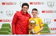 29 May 2019; The SPAR FAI Primary School 5s National Finals took place in AVIVA Stadium on Wednesday, May 29, where former Republic of Ireland International Keith Andrews and current Republic of Ireland women's footballer, Megan Campbell were in attendance supporting as girls and boys from 13 counties battled it out for national honours. The 2019 SPAR FAI Primary School 5s Programme was the biggest yet with a record 37,448 participants from 1,696 schools taking part in county, regional and provincial blitzes nationwide. Pictured is Luke O'Donnell of St. Oran's NS, Cockhill, Co. Donegal, being presented their Player Of The Tournament award by former Republic of Ireland International Keith Andrews at the Aviva Stadium in Dublin.   Photo by Harry Murphy/Sportsfile