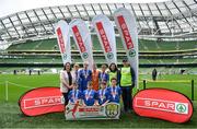 29 May 2019; The SPAR FAI Primary School 5s National Finals took place in AVIVA Stadium on Wednesday, May 29, where former Republic of Ireland International Keith Andrews and current Republic of Ireland women's footballer, Megan Campbell were in attendance supporting as girls and boys from 13 counties battled it out for national honours. The 2019 SPAR FAI Primary School 5s Programme was the biggest yet with a record 37,448 participants from 1,696 schools taking part in county, regional and provincial blitzes nationwide. Pictured are players and coaches from Clonlisk NS, Birr, Co Offaly with Spar Representative Helen Somerville. Photo by David Fitzgerald/Sportsfile