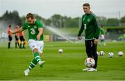 30 May 2019; Republic of Ireland assistant coach Robbie Keane watches Alan Judge of Republic of Ireland warm-up prior to the Friendly match between Republic of Ireland and Republic of Ireland U21's at the FAI National Training Centre in Dublin. Photo by Harry Murphy/Sportsfile