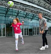 29 May 2019; Republic of Ireland International James McClean with Eden Murphy, age 9, from Ringsend, Co Dublin at the Aviva Soccer Sisters Dream Camp in Aviva Stadium. Over 100 girls were given the opportunity to play on the same pitch as their international heroes. This year’s Aviva Soccer Sisters saw a 107% increase on last year’s figures, with 7,322 girls participating in this year’s Easter festival throughout the country. See aviva.ie/soccersisters or check out #SafeToDream on social media for further details. Photo by David Fitzgerald/Sportsfile