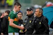 1 June 2019; Sean O'Shea of Kerry with Kerry manager Peter Keane as he leaves the field following a collision with Kevin Harnett of Clare during the Munster GAA Football Senior Championship semi-final match between Clare and Kerry at Cusack Park in Ennis, Co Clare. Photo by Diarmuid Greene/Sportsfile
