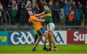 1 June 2019; Kevin Harnett of Clare and David Clifford of Kerry tussle off the ball during the Munster GAA Football Senior Championship semi-final match between Clare and Kerry at Cusack Park in Ennis, Co Clare. Photo by Diarmuid Greene/Sportsfile