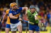 2 June 2019; Donal Tuohy of Clare in action against Séamus Callanan of Tipperary during the Munster GAA Hurling Senior Championship Round 3 match between Clare and Tipperary at Cusack Park in Ennis, Co. Clare. Photo by Diarmuid Greene/Sportsfile
