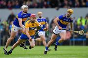 2 June 2019; John Conlon of Clare is fouled by Pádraic Maher of Tipperary, left, as team-mate Barry Heffernan looks on during the Munster GAA Hurling Senior Championship Round 3 match between Clare and Tipperary at Cusack Park in Ennis, Co Clare. Photo by Piaras Ó Mídheach/Sportsfile