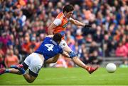 2 June 2019; Jarleth Óg Burns of Armagh scoring his side's first goal despite the attention of Conor Moynagh of Cavan during the Ulster GAA Football Senior Championship Semi-Final match between Cavan and Armagh at St Tiernach's Park in Clones, Monaghan Photo by Oliver McVeigh/Sportsfile