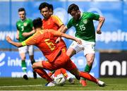 3 June 2019; Aaron Connolly of Republic of Ireland in action against Wei Wu of China during the 2019 Maurice Revello Toulon Tournament match between China and Republic of Ireland at Stade de Lattre de Tassigny in Aubagne, France. Photo by Alexandre Dimou/Sportsfile