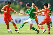 3 June 2019; Zach Elbouzedi of Ireland in action against Wenjie Lei and Cong Huang of China during the 2019 Maurice Revello Toulon Tournament match between China and Republic of Ireland at Stade de Lattre de Tassigny in Aubagne, France. Photo by Alexandre Dimou/Sportsfile