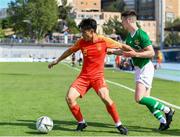 3 June 2019; Lei Tong of China  in action against Darragh Leahy of Ireland during the 2019 Maurice Revello Toulon Tournament match between China and Republic of Ireland at Stade de Lattre de Tassigny in Aubagne, France. Photo by Alexandre Dimou/Sportsfile