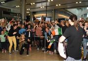 4 June 2019; Katie Taylor arrives back to Dublin Airport following her Undisputed Female World Lightweight Championship bout victory against Delfine Persoon at Madison Square Garden in New York, USA, on Saturday. Pictured is Undisputed World Lightweight Champion Katie Taylor is welcomed by fans at Dublin Airport in Dublin. Photo by Harry Murphy/Sportsfile