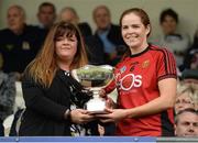2 June 2019; Fionnuala Carr of Down receives the cup  from Ulster Camogie Chairperson Jennifer Cultra after the Ulster Camogie Final match between Antrim and Down at St Tiernach's Park in Clones, Monaghan Photo by Oliver McVeigh/Sportsfile