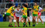8 June 2019; Neamh Woods of Tyrone in action against Katy Herron, left, and Anna Marie McGlynn of Donegal during the TG4 Ulster Senior Championship Preliminary Round match between Donegal and Tyrone at Kingspan Breffni Park in Cavan. Photo by Ramsey Cardy/Sportsfile
