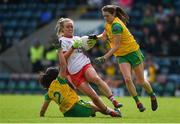 8 June 2019; Neamh Woods of Tyrone in action against Anna Marie McGlynn, left, and Katy Herron of Donegal during the TG4 Ulster Senior Championship Preliminary Round match between Donegal and Tyrone at Kingspan Breffni Park in Cavan. Photo by Daire Brennan/Sportsfile