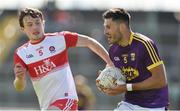 8 June 2019; Glen Malone of Wexford in action against Jason Rocks of Derry during the GAA Football All-Ireland Senior Championship Round 1 match between Wexford and Derry at Innovate Wexford Park in Wexford. Photo by Matt Browne/Sportsfile