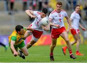 8 June 2019; Paddy McGrath of Donegal in action against Richard Donnelly of Tyrone during the Ulster GAA Football Senior Championship semi-final match between Donegal and Tyrone at Kingspan Breffni Park in Cavan. Photo by Ramsey Cardy/Sportsfile