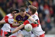 8 June 2019; David Shannon of Wexford in action against Ruairi Mooney and Christopher McKaigue of Derry during the GAA Football All-Ireland Senior Championship Round 1 match between Wexford and Derry at Innovate Wexford Park in Wexford. Photo by Matt Browne/Sportsfile